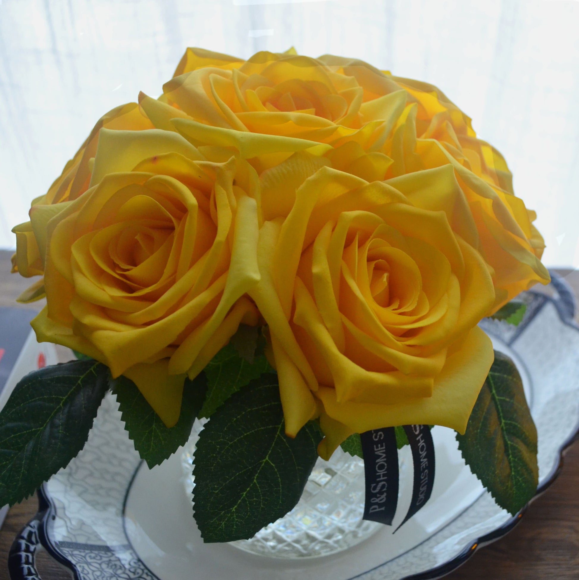 Real touch artificial flower stem yellow rose bouquet in glass vase set in resin illusion water.